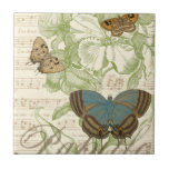 Butterflies on Sheet Music with Floral Design Tile<br><div class="desc">A green floral design and sheet music serves as the background to a trio of butterflies in this piece by Vision Studio. The French word for butterfly, papillon, is emblazoned at the bottom of the piece as well. If you have a strong love of butterflies, nature, or just like surrounding...</div>