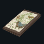 Butterflies on Sheet Music with Floral Design Trifold Wallet<br><div class="desc">A green floral design and sheet music serves as the background to a trio of butterflies in this piece by Vision Studio. The French word for butterfly, papillon, is emblazoned at the bottom of the piece as well. If you have a strong love of butterflies, nature, or just like surrounding...</div>
