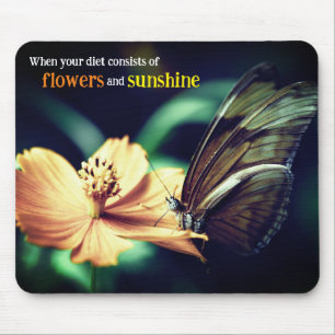 Butterfly feeding on flower mouse pad