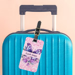 Butterfly pink purple flowers luggage tag<br><div class="desc">A girly pink background decorated with a purple butterfly,  pink and purple flowers,  pink confetti. Personalise and add your name and contact details.</div>