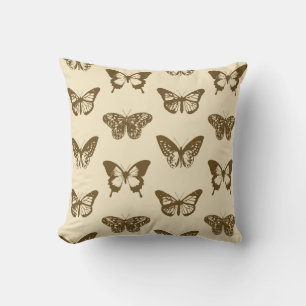 Butterfly sketch, chocolate brown on beige cushion