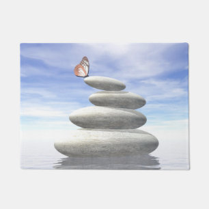 Butterfly upon balanced stones doormat