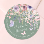 Butterfly Wildflower Bridal Shower Classic Round Sticker<br><div class="desc">A Lifetime Of Butterflies Bridal Shower Round Sticker. Add a sweet and whimsical touch to your bridal shower favours, packaging, or decorations with this round sticker design, perfect for a butterfly-themed celebration. The layout features delicate watercolor wildflowers and greenery with multiple pink and purple butterflies fluttering across the design. The...</div>