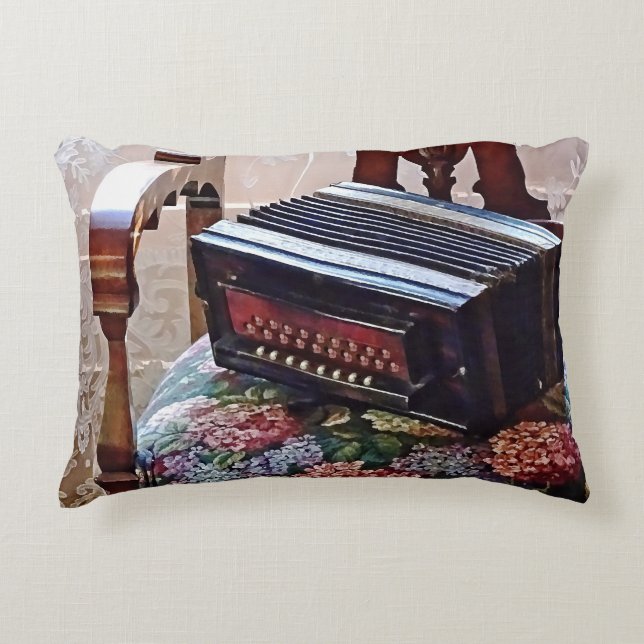 Button Accordion on Chair With Flowered Seat Decorative Cushion (Front)