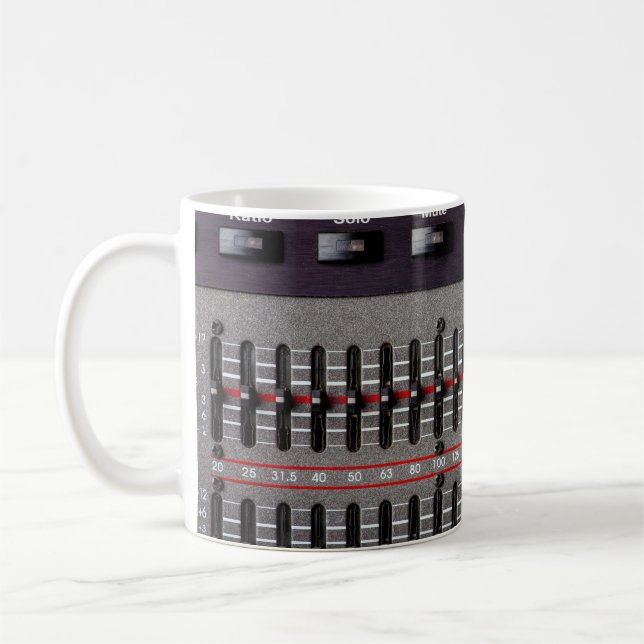 Buttons on a sound mixer in a recording studio. coffee mug (Left)