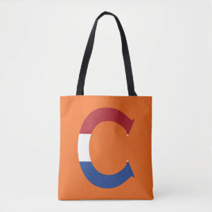 C Monogram overlaid on NLD Flag on or stcnt Tote Bag