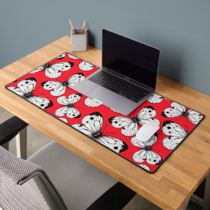 Cabbage butterfly pattern on red desk mat