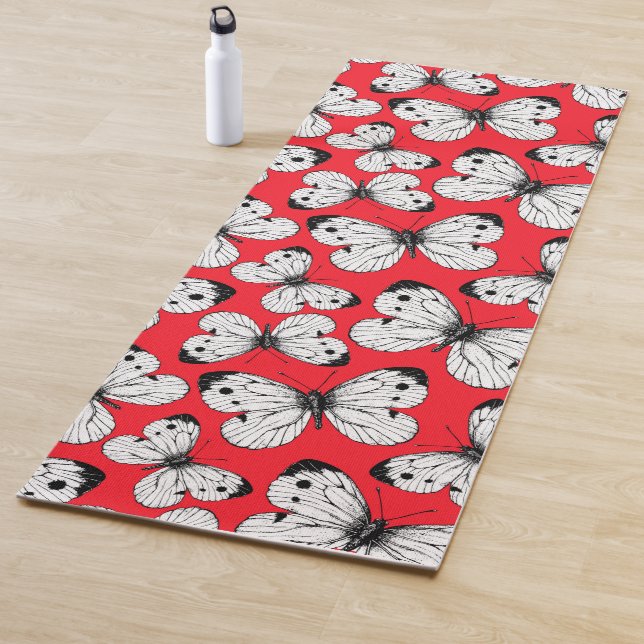 Cabbage butterfly pattern on red yoga mat (In Situ)