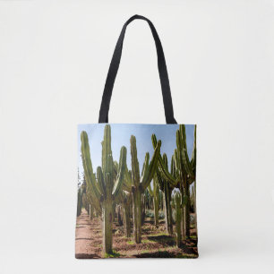 Cacti garden. Green tall cacti and succulents grow Tote Bag