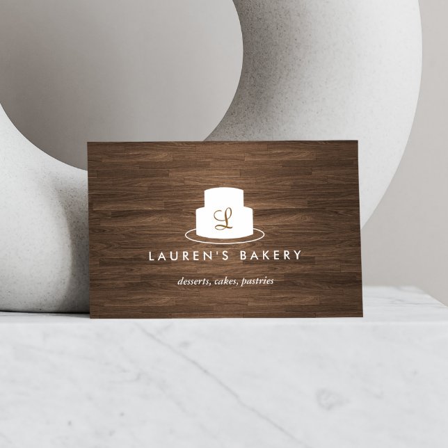 Cake Monogram Logo in White on Brown Woodgrain Business Card (Creator Uploaded)