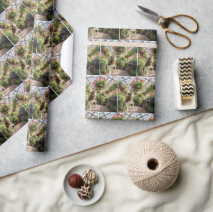 Calico Cat on a Stool in a Greenhouse Wrapping Paper
