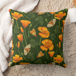 California poppies and moths on dark green cushion