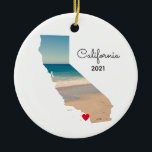 California Vacation Places Visited Ceramic Ornament<br><div class="desc">Add a photo over the top of the map shape of the state of California. My sample photo was taken during a road trip to the aquarium and beach near Monterey Bay. You can change the heart colour, move it, or delete that text symbol. Personalised text on back with information...</div>