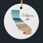 California Vacation Places Visited Ceramic Ornament<br><div class="desc">Add a photo over the top of the map shape of the state of California. My sample photo was taken during a road trip to the aquarium and beach near Monterey Bay. You can change the heart colour, move it, or delete that text symbol. Personalised text on back with information...</div>