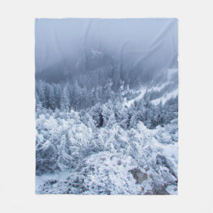 Calm foggy winter day on top of the mountains fleece blanket