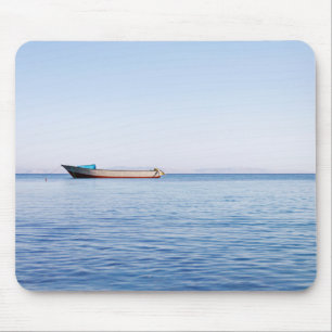 Calm sea boat mouse pad
