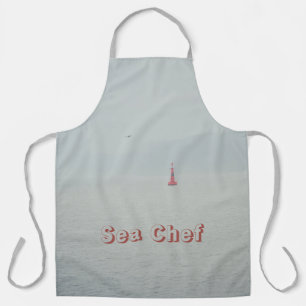 Calm winter sea and red lighthouse apron