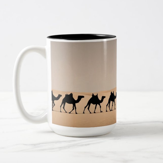 Camel caravan in the desert Two-Tone coffee mug (Left)