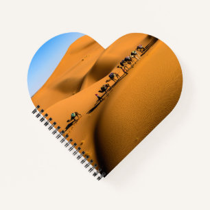 camels on desert under blue sky notebook