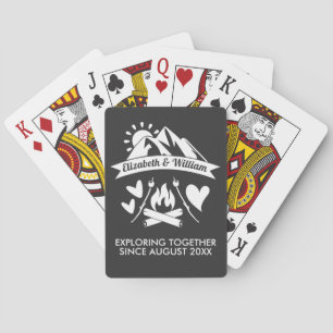 Camping couple mountain bonfire exploring together playing cards