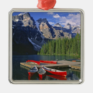 Canada, Alberta, Moraine Lake. Red canoes await Metal Ornament