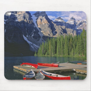 Canada, Alberta, Moraine Lake. Red canoes await Mouse Pad