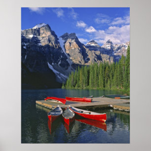Canada, Alberta, Moraine Lake. Red canoes await Poster