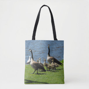 Canada Geese on the Grass by the Water Tote Bag