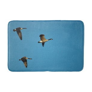 Canadian geese in flight bath mat