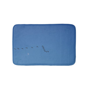 Canadian geese in flight bath mat