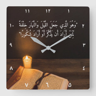 Candle and Quran with bead in dark room Square Wall Clock