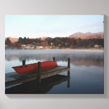 Canoe on a dock by a lake.