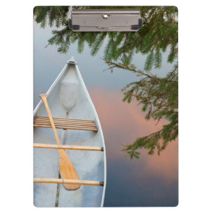 Canoe on lake at sunset, Canada Clipboard