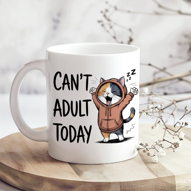 "Can't Adult Today" Funny Cat Coffee Mug ("Can't Adult Today" Funny Cat Coffee Mug on a sunny boho kitchen table with tiny dry flowers)