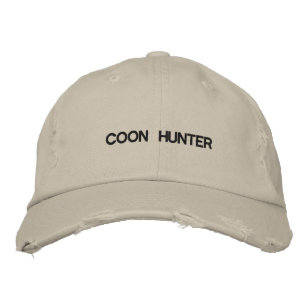 Cap with COON HUNTER on the front.