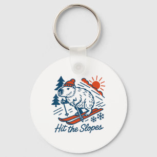 Capyra Shredding The Slopes Winter Mountain Skiing Key Ring
