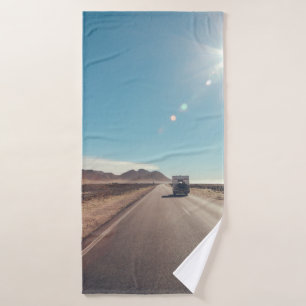 Car on black asphalt road bath towel