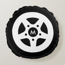 Car wheel throw pillow with black tires and rims