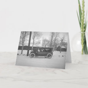 Car with a Christmas tree tied to the hood. Holiday Card