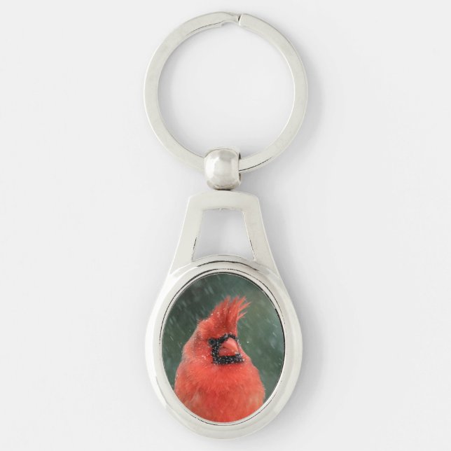 Cardinal in a pine tree during a snow storm key ring (Front)