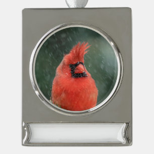 Cardinal in a pine tree during a snow storm silver plated banner ornament