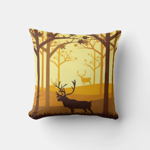 Caribou silhouette in the forest on the autumn sea cushion