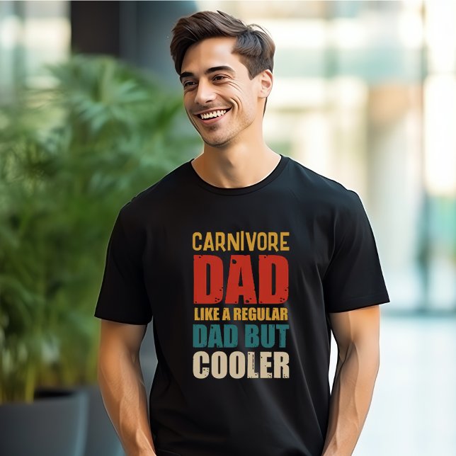 Carnivore Dad Like A Regular Dad But Cooler T-Shirt (Handsome man wearing a black t-shirt with the words "Carnivore Dad - Like A Regular Dad But Cooler")
