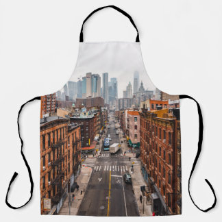 CARS ON ROAD BETWEEN HIGH RISE BUILDINGS DURING DA APRON