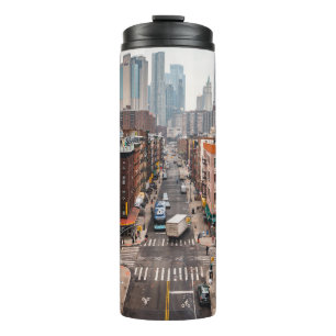 CARS ON ROAD BETWEEN HIGH RISE BUILDINGS DURING DA THERMAL TUMBLER