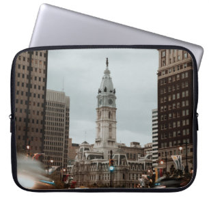 CARS ON ROAD NEAR HIGH RISE BUILDINGS DURING DAYTI LAPTOP SLEEVE