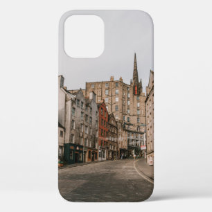 CARS PARKED BESIDE BROWN CONCRETE BUILDING DURING  iPhone 12 CASE