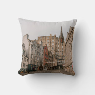 CARS PARKED BESIDE BROWN CONCRETE BUILDING DURING CUSHION