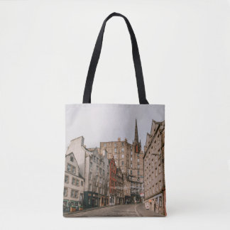 CARS PARKED BESIDE BROWN CONCRETE BUILDING DURING TOTE BAG