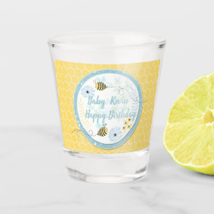 Cartoon bumblebees on a background of blue, yellow shot glass
